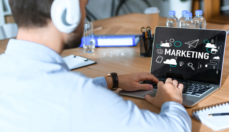 cropped shot of businessman in headphones listening music and wo How to Choose the Right Digital Marketing Agency for Your Brand
