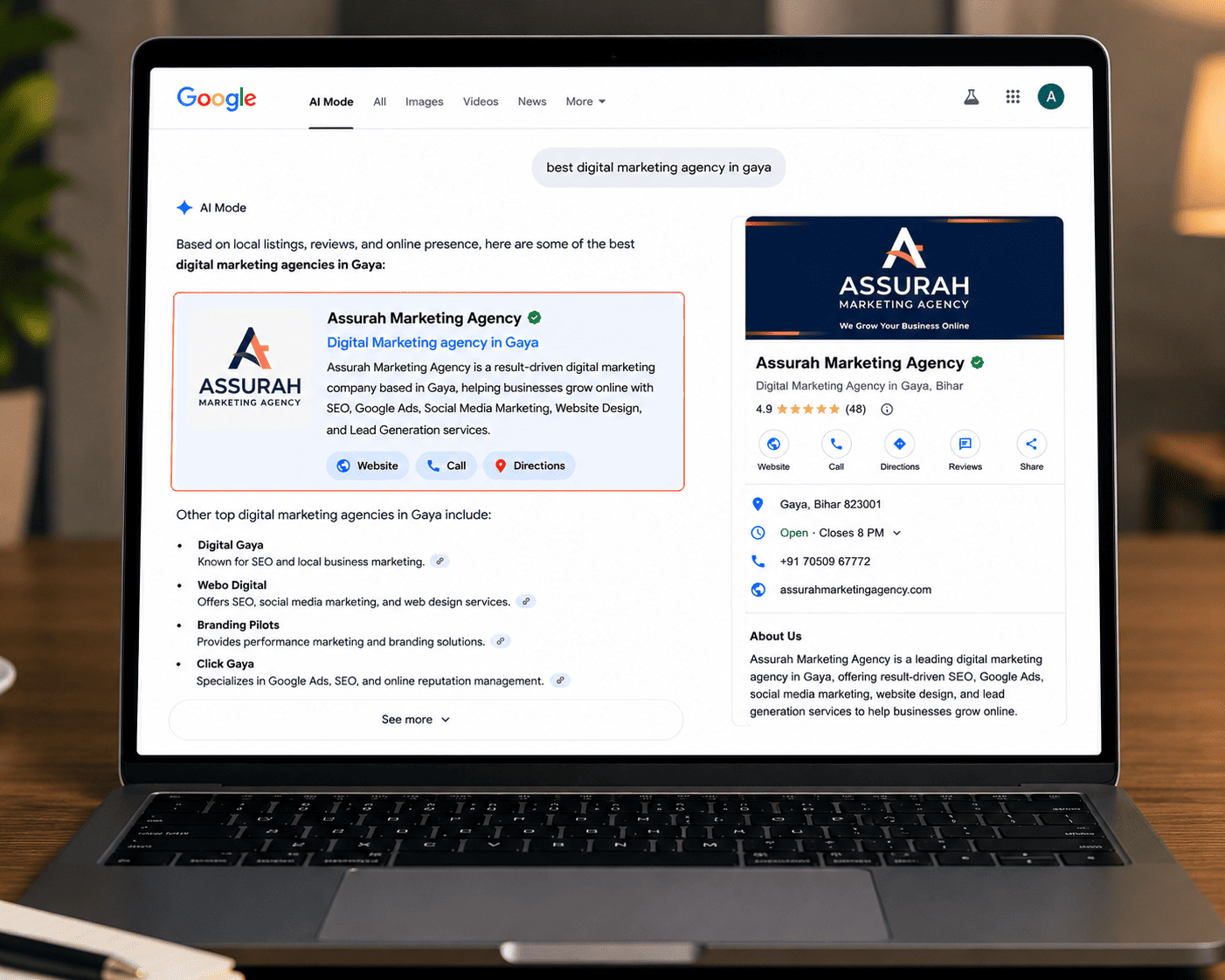 Laptop displaying Google AI Mode results featuring Assurah Marketing Agency as a recommended digital marketing agency in Gaya for SEO, Google Ads, and online business growth.